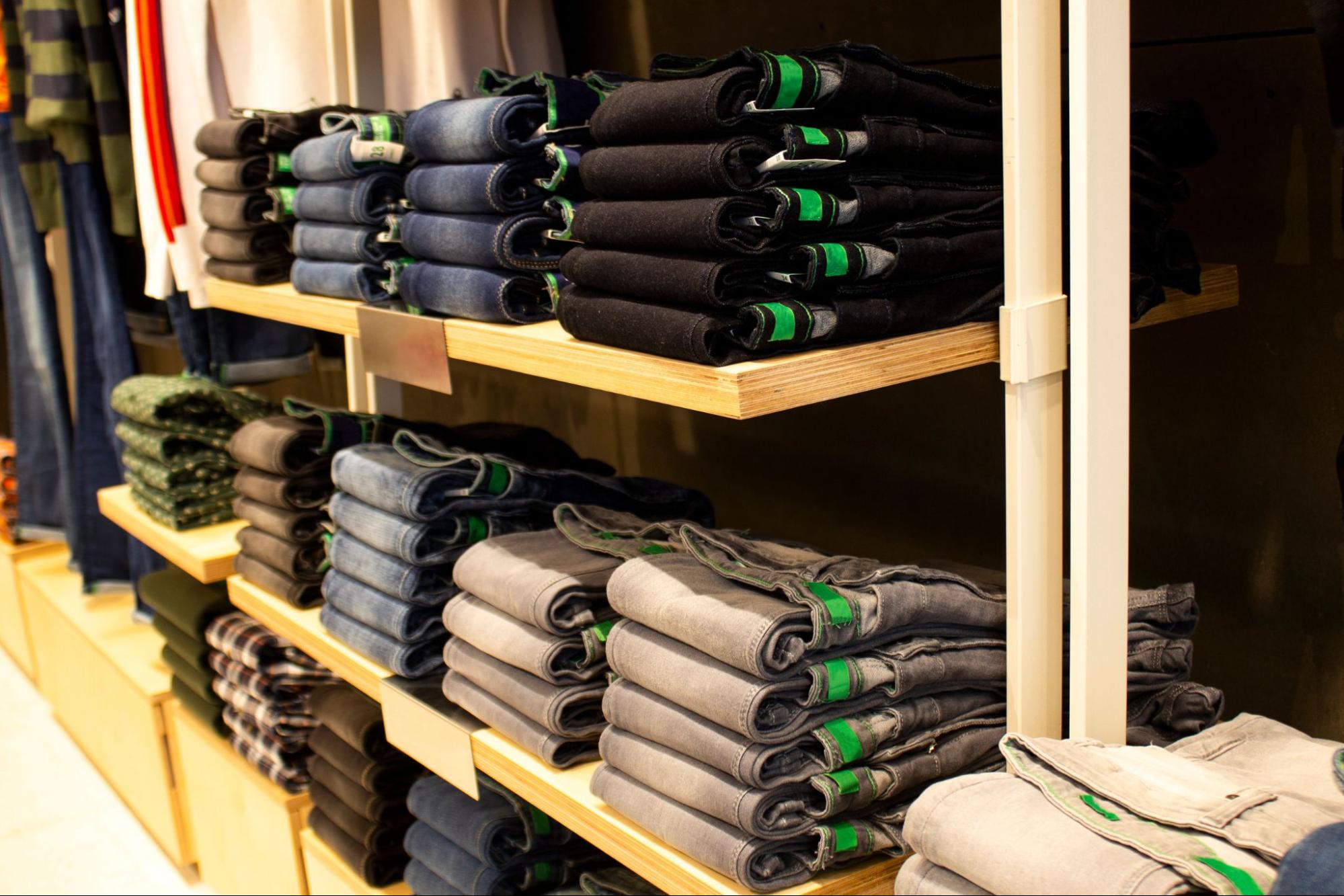 Clothes arranged on shelves