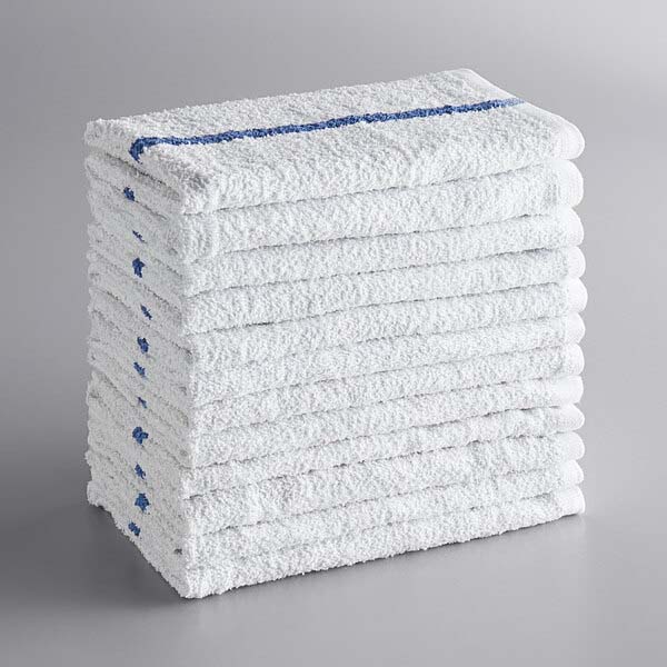 A stack of white towels with blue center lines.