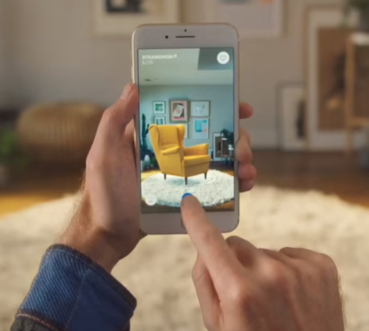 IKEA Place app showing a virtual chair against a customer's home background.