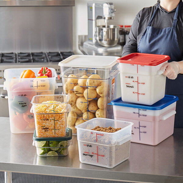 Putting food in lidded, heavy-duty plastic containers.