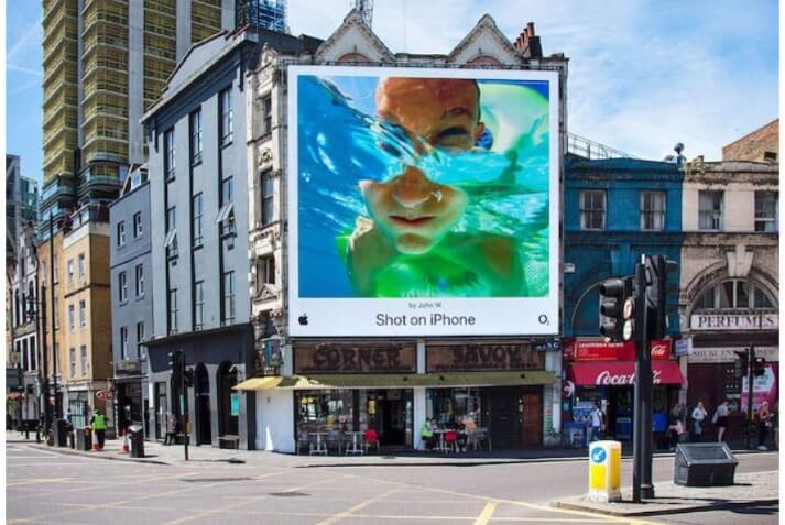 A billboard by Apple featuring an image by an iPhone user