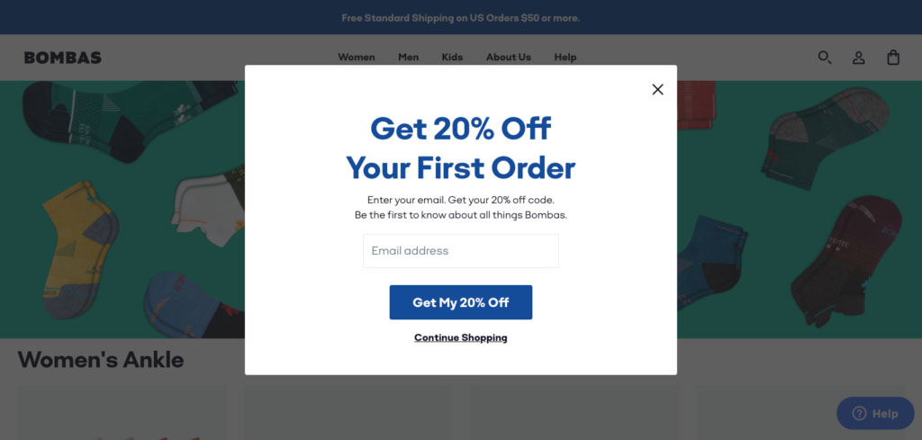 A screenshot showing the Bombas online store with a popup prompting the visitor to email their email for a 20% coupon.