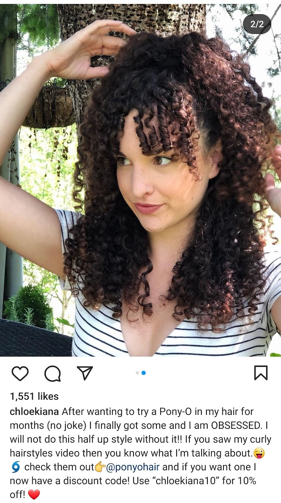 A screenshot showing an Instagram post with a picture of a curly-haired person and its caption advertising a product.
