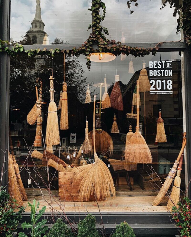 Halloween retail window display using brooms 