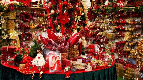 Christmas store with table display of holiday merchandise. 