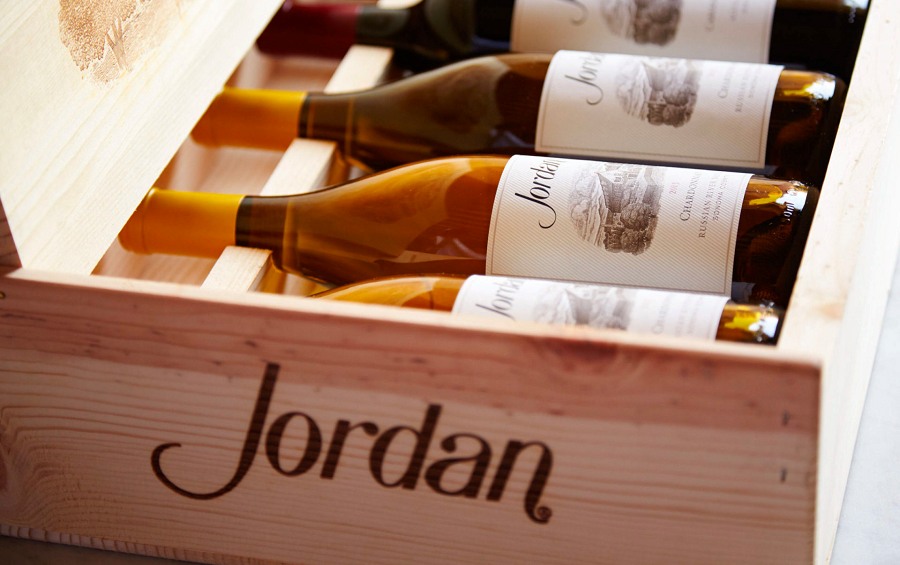 Wines from Jordan Winery neatly arranged in a case.