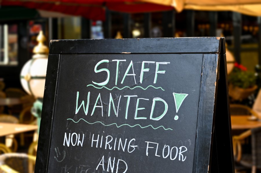 Licensed Expand Image Staff wanted recruitment sign outside a restaurant in Europe.
