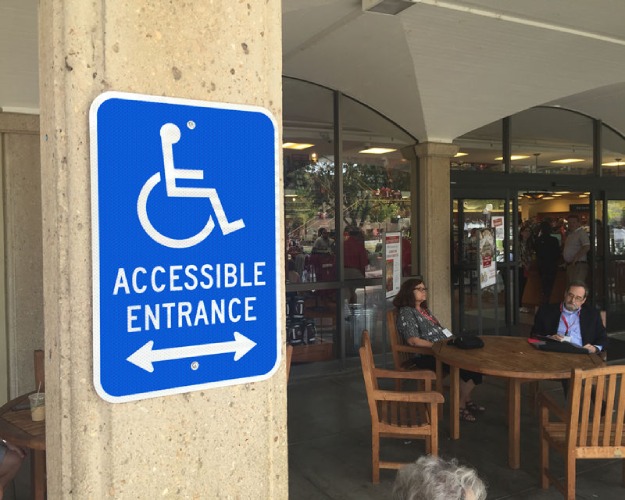 Accessible entryway marked with signage.