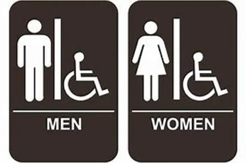 Bathroom signage featuring symbols for men, women, and handicapped.