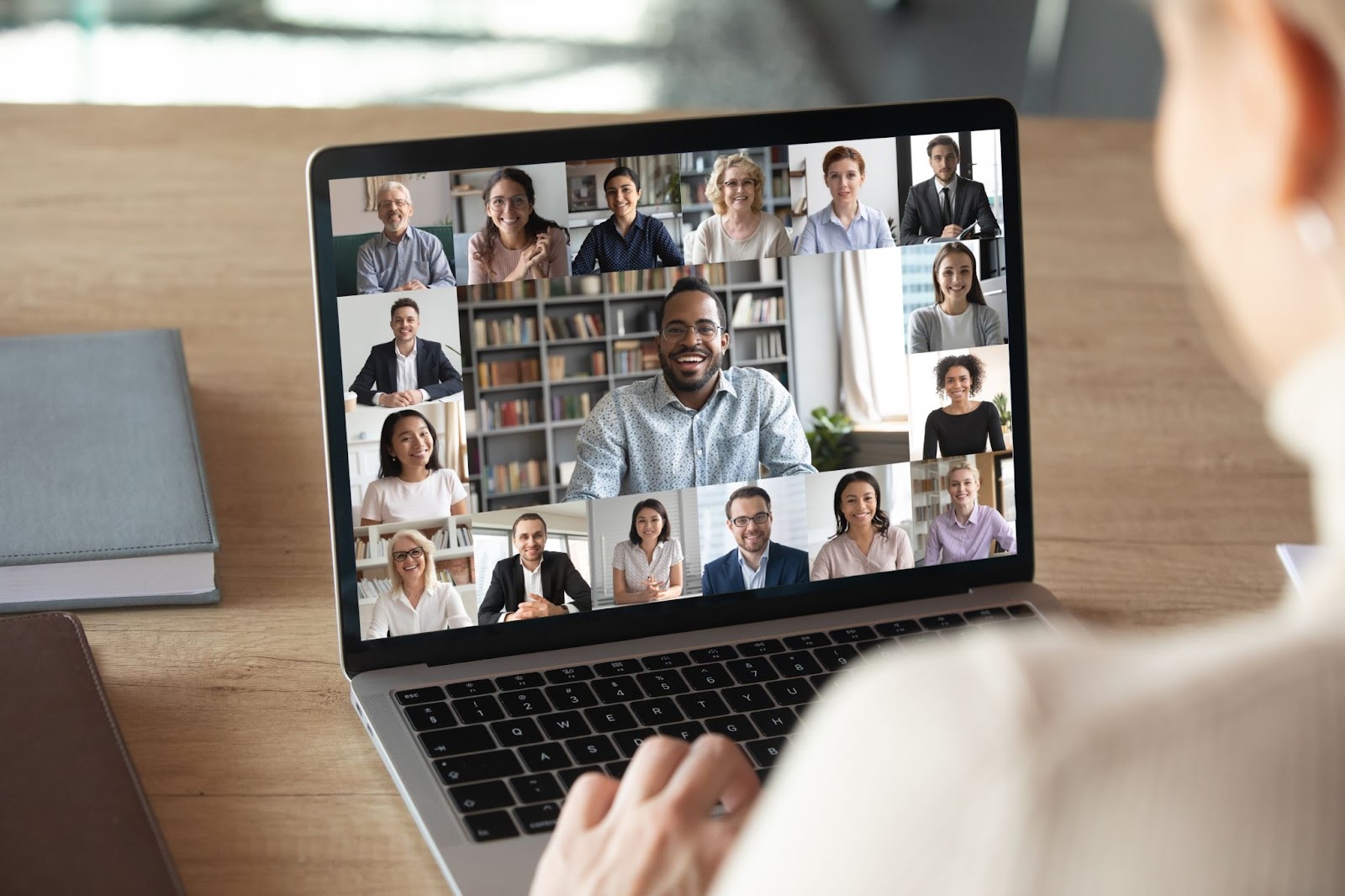 A laptop with different people in one video conference