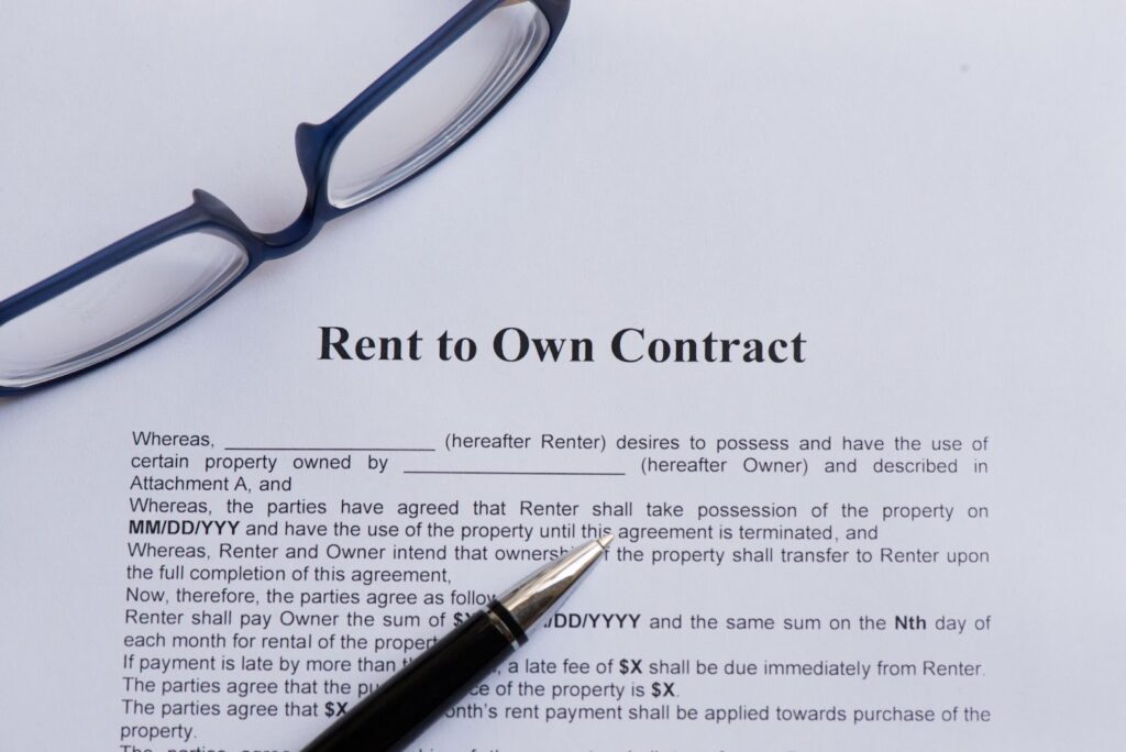 A sample contract with an eye glasses and pen on top of it.