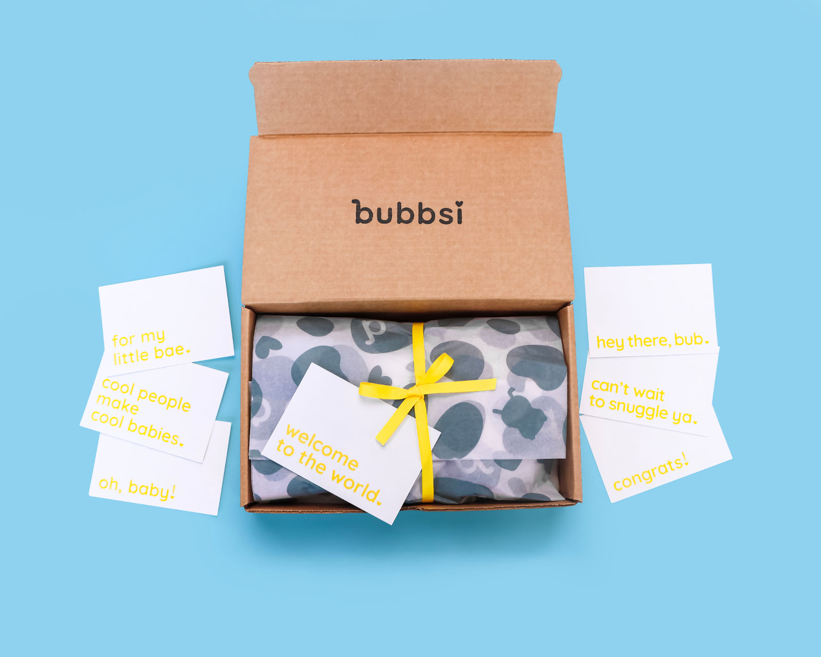 Bubbsi custom packaging with card inserts, branded tissue paper, and ribbon.