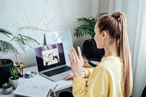 Young woman applicant having online virtual video call job interview meeting with female hr recruiter or employer.