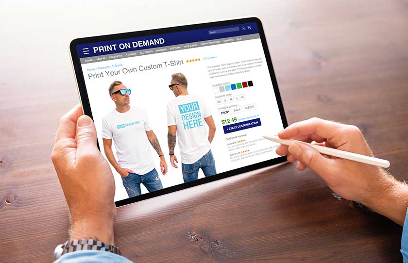Man creating custom design t-shirt on print on demand service.