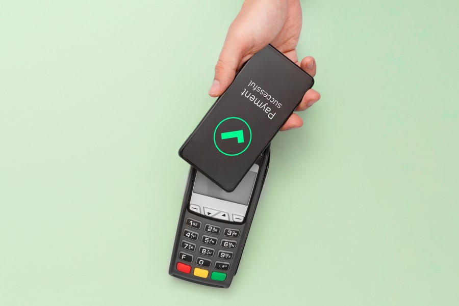 hand holding a payment machine