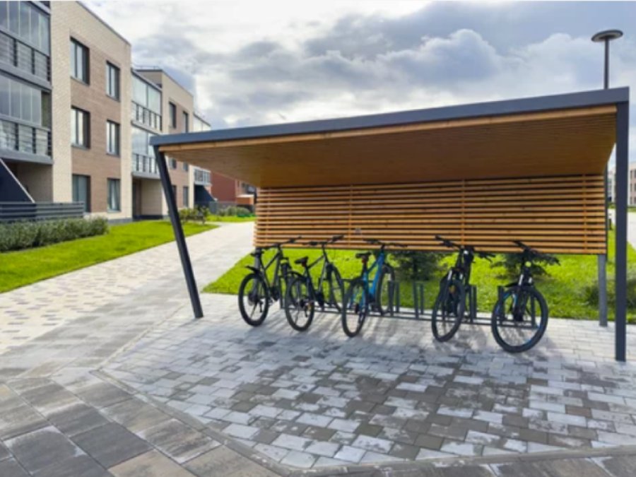 Covered bicycle parking in a residential area.