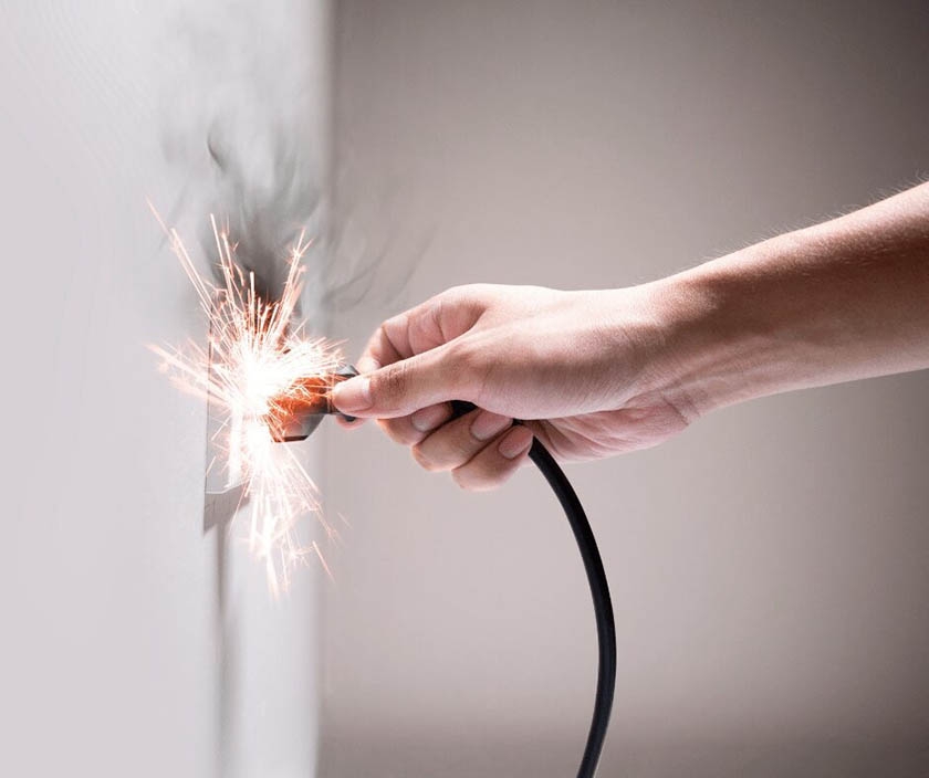Sparks on an electrical outlet.
