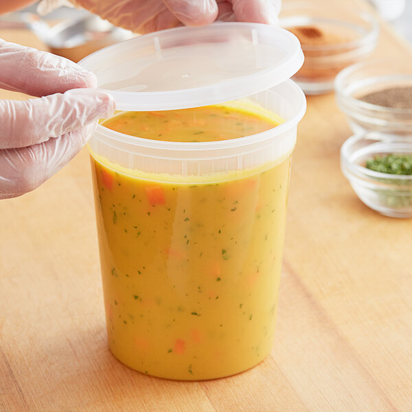 Lidded plastic quart container filled with soup