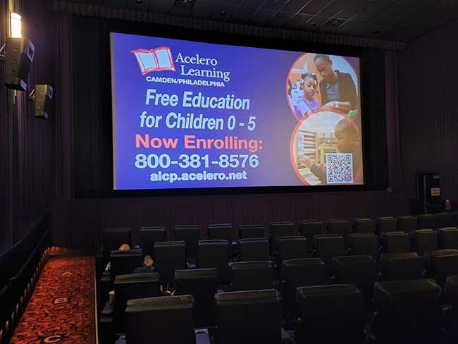 Movie theater screen with ad
