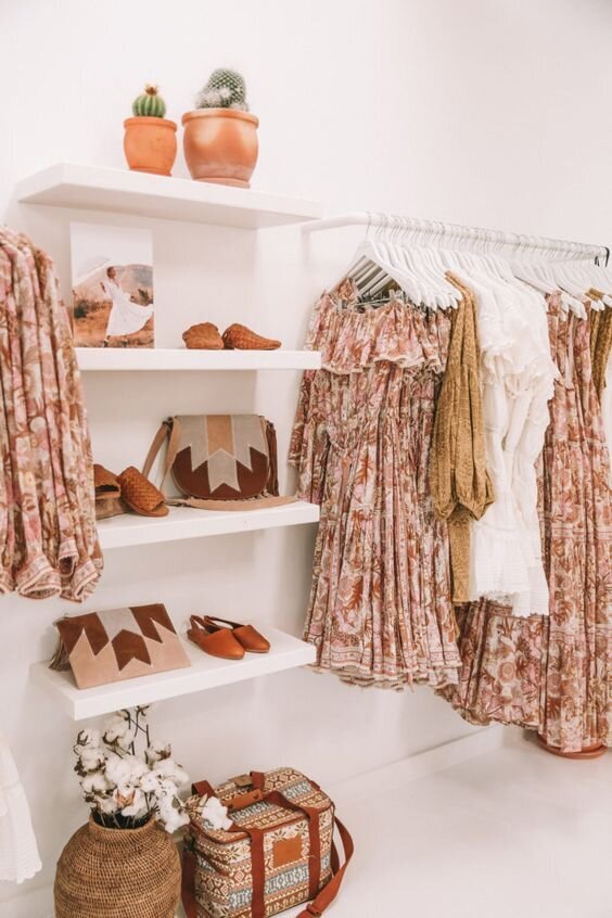 Store with pink products all displayed in one section, including dresses and accessories
