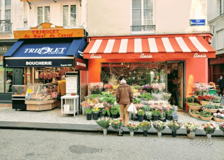 Corner flower store with flower arrangements at the storefront