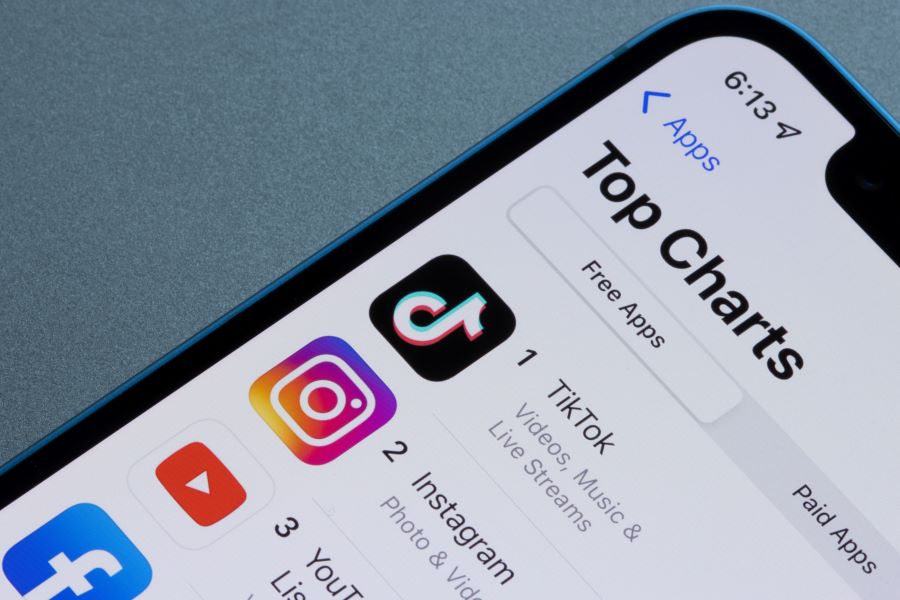 App Store's free apps top charts are seen on an iPhone. Social media apps TikTok, Instagram, YouTube, and Facebook