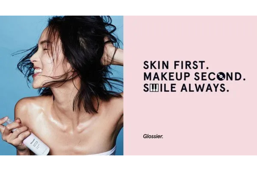 The Glosser brand logo and "Skin First. Makeup Second" tagline from an ad