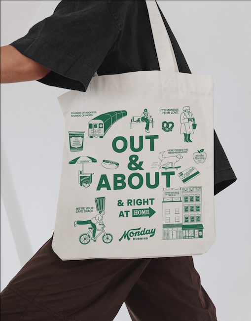 A sample branded tote bag with Monday Morning Management's illustrations and brand colors.