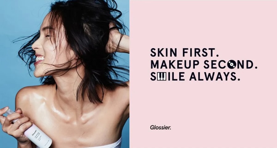 Glossier's "Skin first makeup second" brand philosophy and tagline.