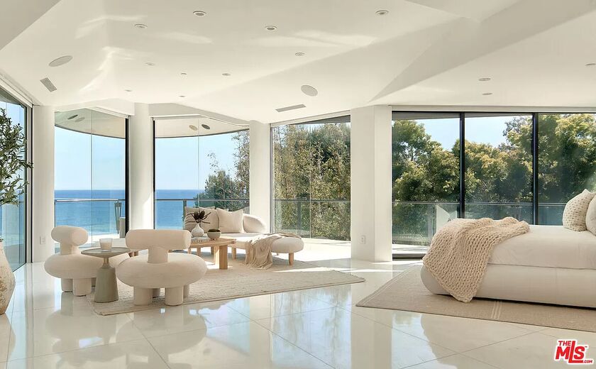 Interior of a luxury property with windows overlooking an ocean view