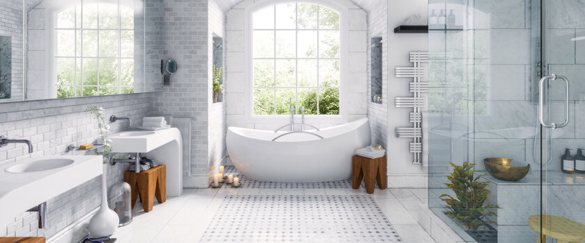 A bathroom that has a bathtub, shower, and sinks.