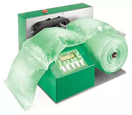 A small, green machine producing green air pillows.