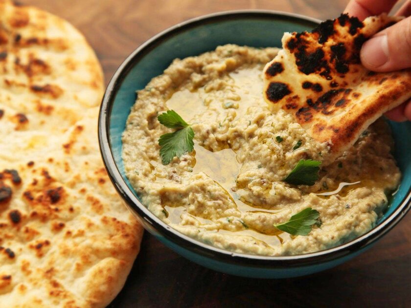 Close-up shot of a bowl of baba ganoush used as a dip for pita bread