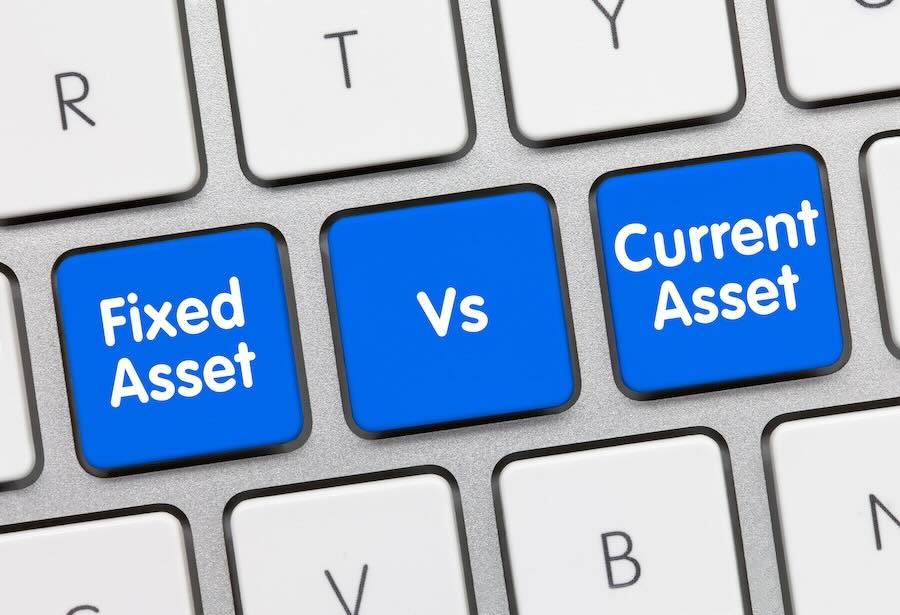 Fixed Asset vs. Current Asset - Inscription on Blue Keyboard Key.
