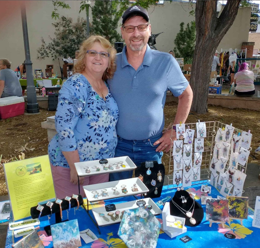 Kerrie and Roy Lapoehn at the Loveland Pocket Park selling jewelry.