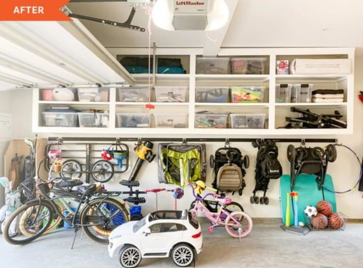 Garage with full hanging shelves, bikes, and toys