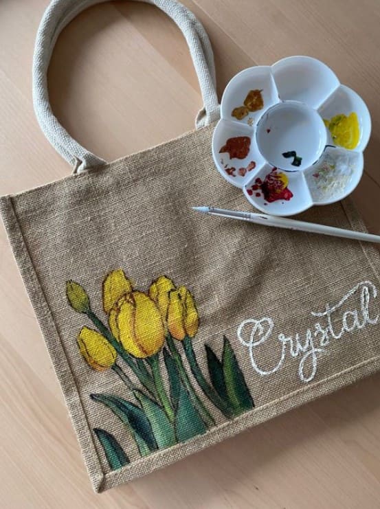 Yellow tulips painted on jute shopping bag