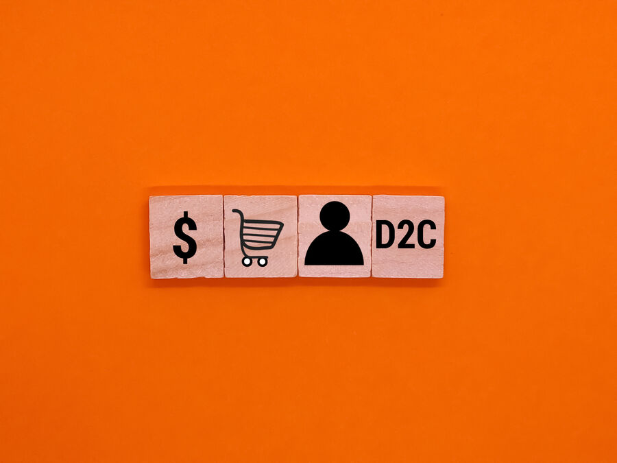 Symbolic icons meet the concept of Direct to Consumer D2D orange background. Business concept.