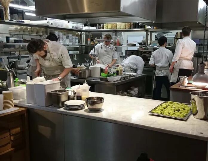 chefs working in a kitchen