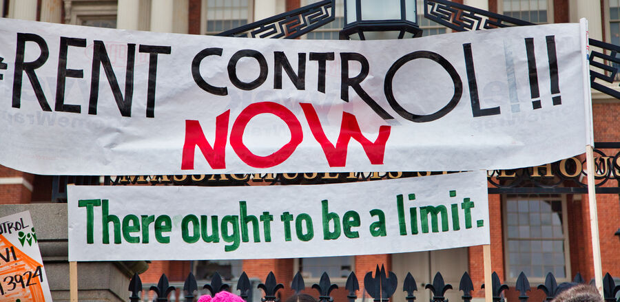 "Rent control now" signage