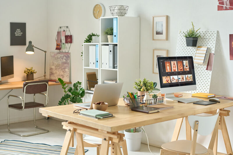 Minimalist workspace with shelves and an open table layout.