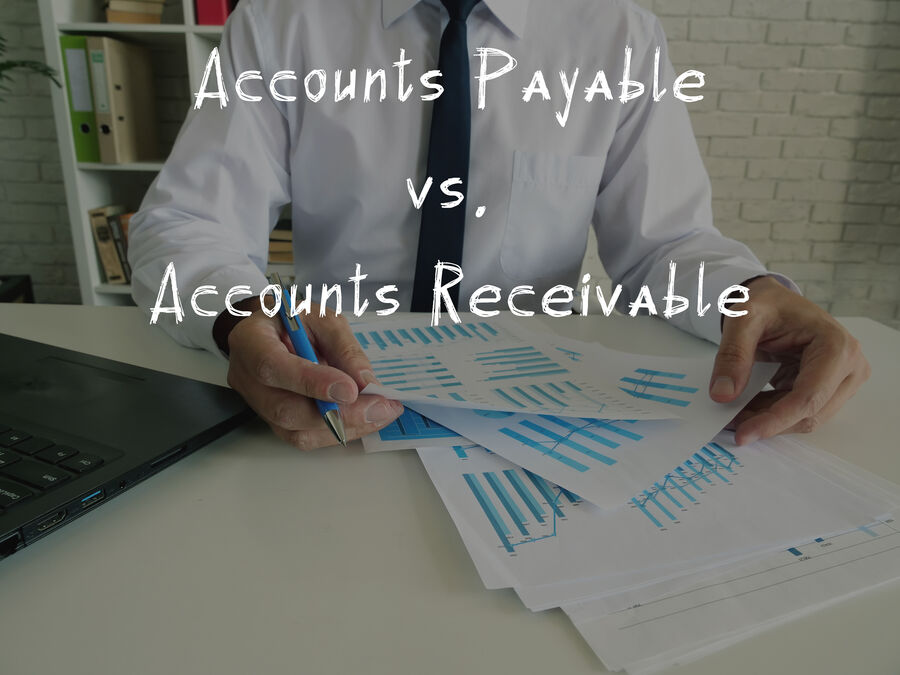 Accounts Payable vs. Accounts Receivable with sign on the sheet.