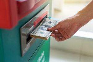 closeup woman withdrawing cash