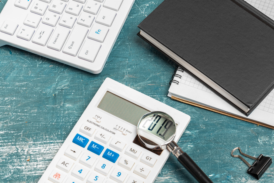 Office table with paper and calculator