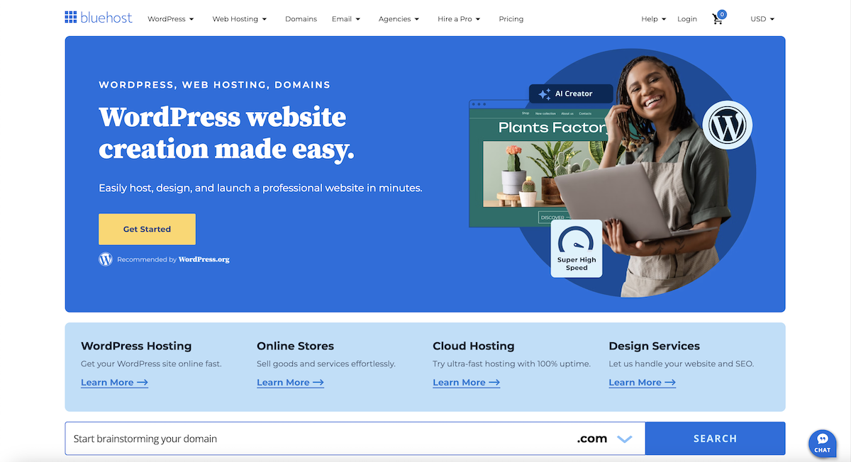 Bluehost homepage with the headline, "WordPress website creation made easy," and a hero image with a young black woman with a laptop in front of a website demo image for "plants factory."