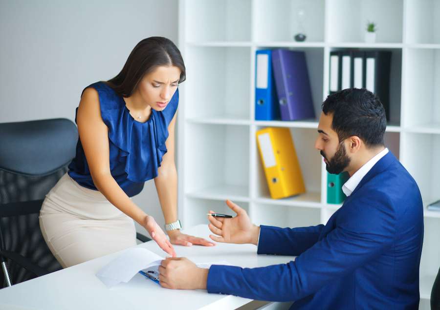 Business woman and business man leading talks at the office.