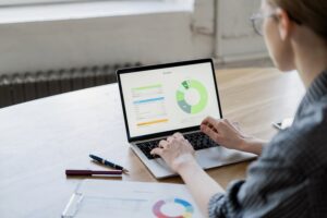 The laptop screen works with documents in the office workplace finance report