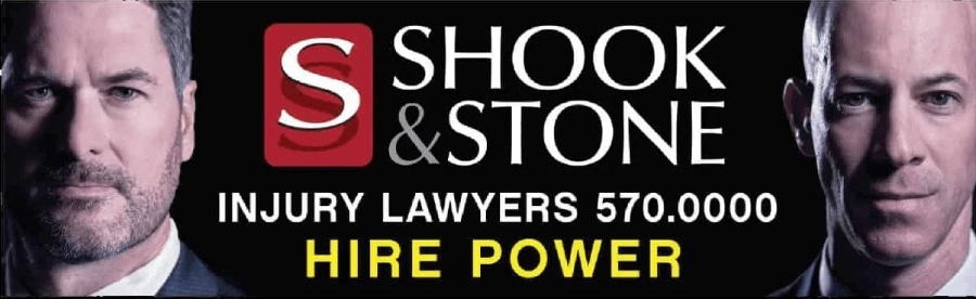 Billboard designed by Avalaunch Media for Shook & Stone Injury Lawyers with black background and portraits of the 2 lawyers flanking the logo, phone number and tagline "Hire Power".