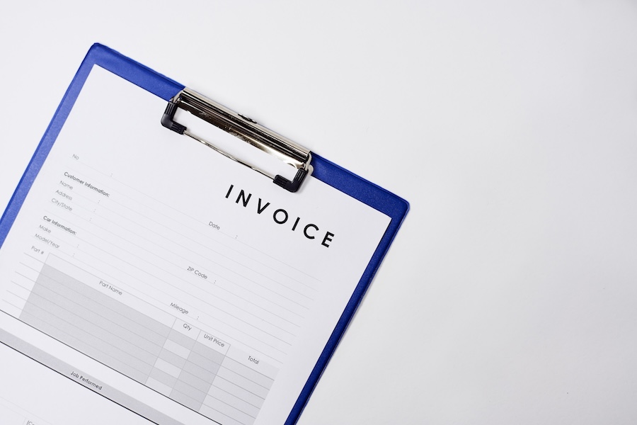 Closeup shot of an invoice document on a white surface