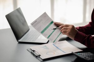 Business men are looking at the company's financial documents to analyze problems and find solutions